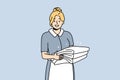 Smiling housekeeper with stack of towels