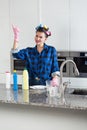 Smiling housewife with hair rollers