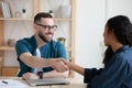 Smiling hr manager shaking hands with african american job applicant. Royalty Free Stock Photo