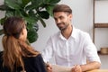 Smiling hr manager talking with candidate on job interview