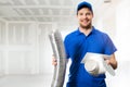 Hvac technician ready to install ventilation system in house Royalty Free Stock Photo