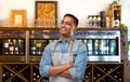 Smiling indian barman or waiter in apron at bar Royalty Free Stock Photo