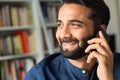 Smiling indian business man talking on phone making call, closeup. Royalty Free Stock Photo