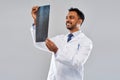 Smiling indian doctor looking at spine x-ray Royalty Free Stock Photo