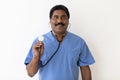 Smiling Indian Doctor Man With Stethoscope In Hand Posing Over White Background Royalty Free Stock Photo