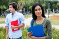 Smiling indian female student with caucasian male student Royalty Free Stock Photo