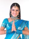 Smiling indian girl in welcome posture Royalty Free Stock Photo