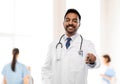Smiling indian male doctor pointing finger to you Royalty Free Stock Photo