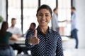 Smiling indian recruiter stretch hand welcoming new employee