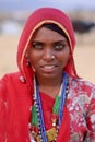 A smiling indian woman dressed in traditional Rajasthani clothing at Pushkar Camel Fair, North Western India