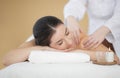 Smiling Indian Woman Enjoying Shoulders Massage In Spa Salon Royalty Free Stock Photo