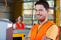Smiling industrial worker at factory Royalty Free Stock Photo
