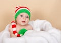 Smiling infant in red cap. Kid enjoy the holiday. Merry Christmas Royalty Free Stock Photo