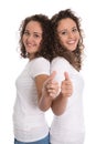 Smiling isolated girls with thumbs up: real twins.