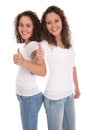 Smiling isolated girls with thumbs up: real twins.