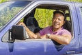 Smiling Man In Blue Pickup Truck Royalty Free Stock Photo