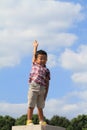 Smiling Japanese boy under the blue sky Royalty Free Stock Photo