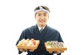 Smiling Japanese chef with sushi Royalty Free Stock Photo