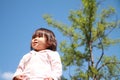 Smiling Japanese girl under the blue sky Royalty Free Stock Photo