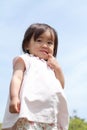 Smiling Japanese girl under the blue sky Royalty Free Stock Photo