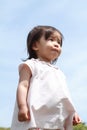 Smiling Japanese girl under the blue sky Royalty Free Stock Photo