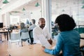 Smiling job applicant answering questions during an office interview