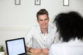 Smiling job candidate happily answering recruiter question durin