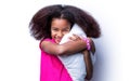 Smiling kid girl holding cushion. Smile little african american girl hold kissen. Morning little girl - pillow, cushion