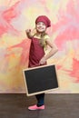 Smiling kid, happy girl cook in red chef hat, apron Royalty Free Stock Photo