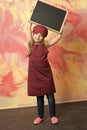 Smiling kid, happy girl cook in red chef hat, apron Royalty Free Stock Photo