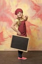 Smiling kid, happy girl cook in red chef hat, apron Royalty Free Stock Photo