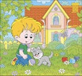 Little boy with a grey kitten on a lawn