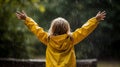 child enjoying the rain outdoors