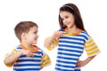 Smiling kids brushing teeth