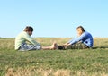 Smiling kids exercising on meadow