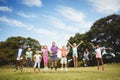 Smiling kids jumping together during a sunny day Royalty Free Stock Photo