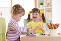 Smiling kids painting at home or day care center Royalty Free Stock Photo