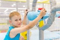 Smiling kids plays with air gun in children game center Royalty Free Stock Photo