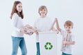 Smiling kids segregating paper waste