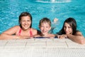 Smiling kids in swimming pool
