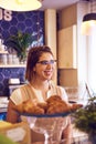 Smiling lady behind plate of croissants Royalty Free Stock Photo