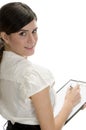 Smiling lady with pen and paper in writing pad Royalty Free Stock Photo