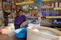 Smiling lady at the small store