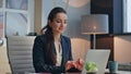 Smiling lady working laptop at buro closeup. Happy woman closing computer lid