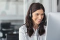 Smiling latin woman in call center Royalty Free Stock Photo