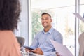 Smiling latin young business man at team work office meeting or job interview. Royalty Free Stock Photo