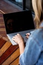 Smiling and laughing handsome young man use and show laptop. brown t-shirt and blue jeans and jacket. business Royalty Free Stock Photo