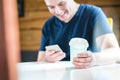 Smiling and laughing happy man using mobile phone. Royalty Free Stock Photo