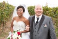 happy newlywed ethnic black African American woman and mid aged blad Caucasian man