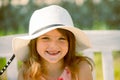 Smiling and laughing kids face closeup. Little girl outdoors, close-up. Portrait of attractive little teen with Royalty Free Stock Photo